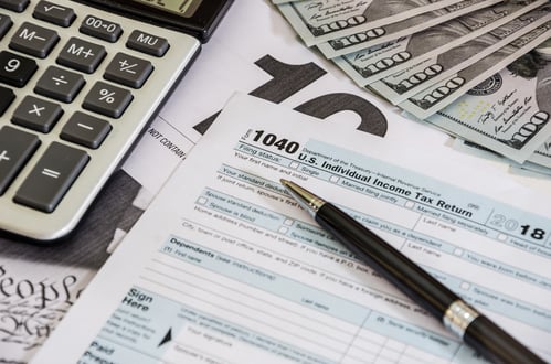 tax-forms-1040-calculator-with-dollars